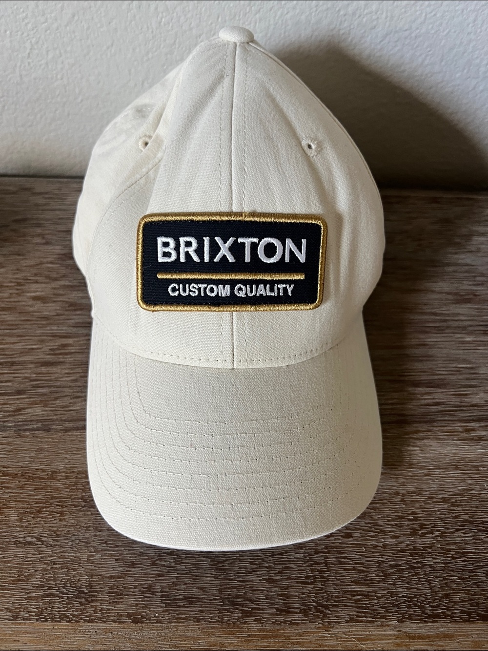 Brixton Cream Baseball Cap with Black & Gold Patch